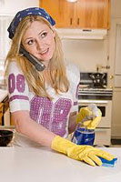 Woman cleaning her counter to protect against food contamination